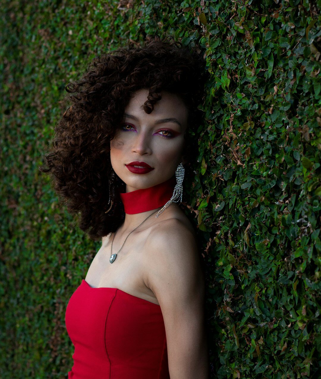 Professional studio portrait of a young Brazilian woman with curly hair