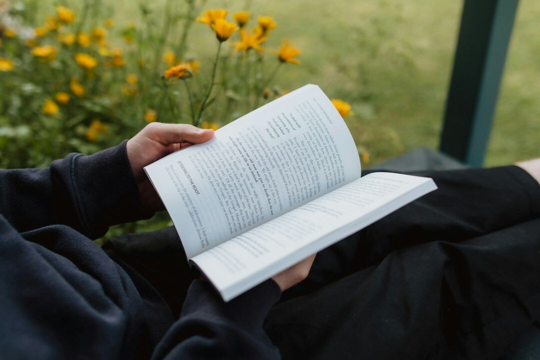 person reading self help book