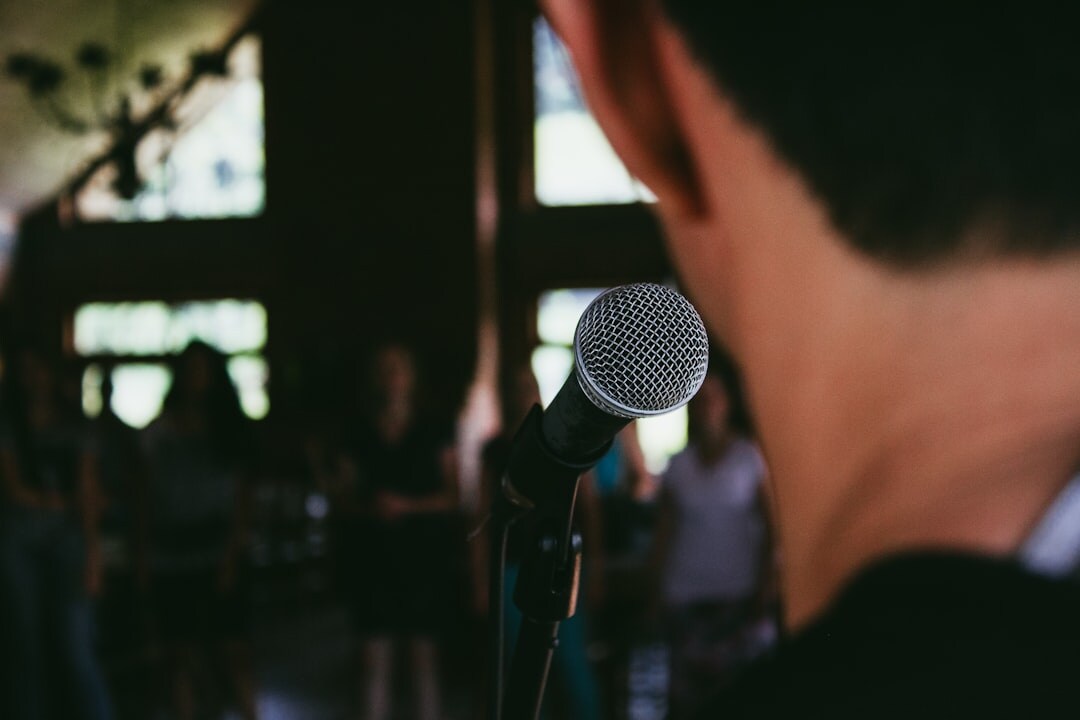person giving speech on stage