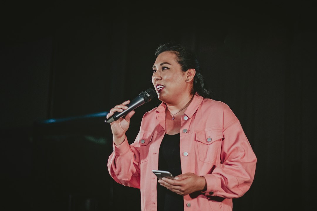 person giving speech on stage